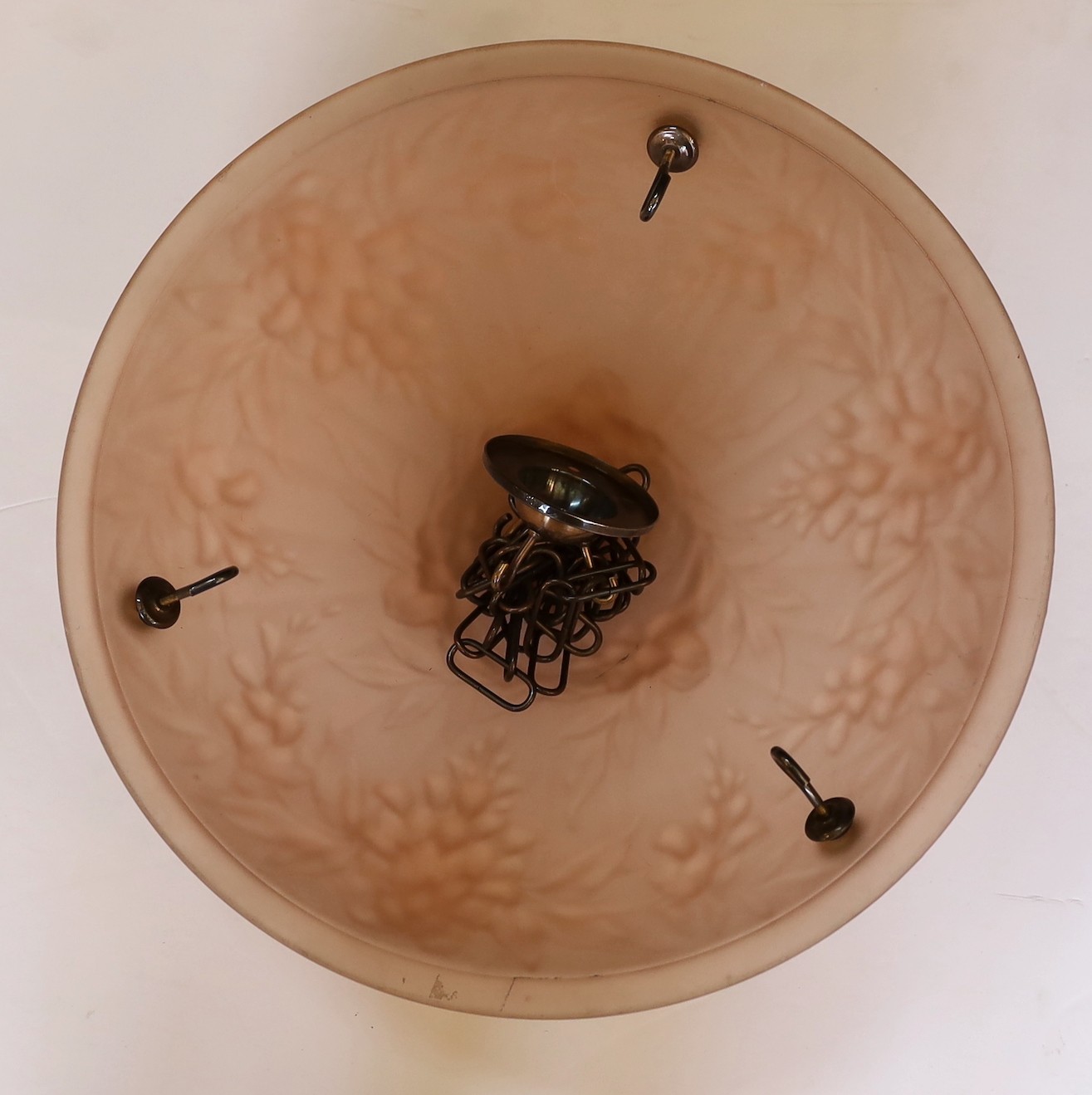 A 1920s – 30s French peach glass light bowl moulded with trailing flowers, with chain set and ceiling rose, diameter 35cm